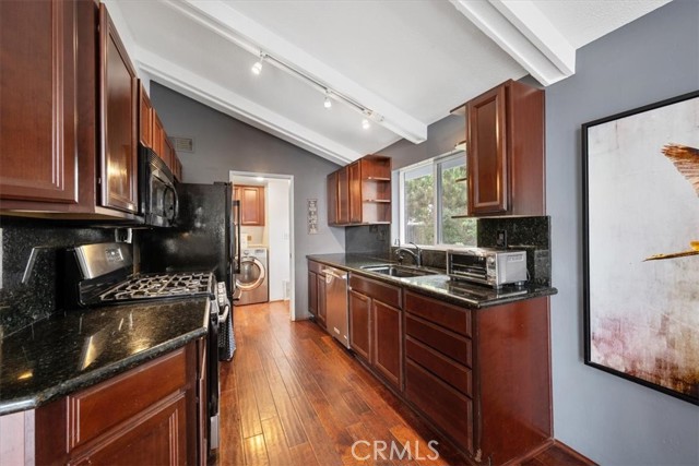 Kitchen has granite countertops and all appliances included in the sale