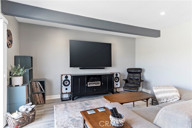 Open Living Room with wood beams.