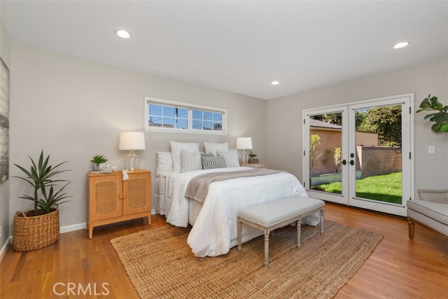 Main Bedroom with French Door Walk Out to backyard, En Suite and walk in closet