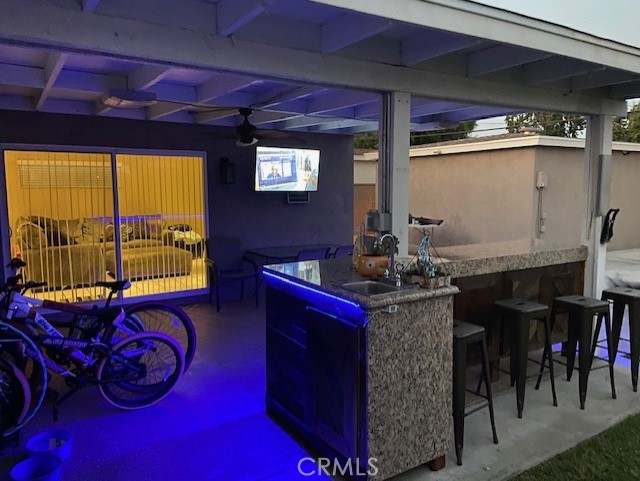 Backyard patio with outdoor bar - evening