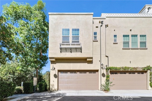 Rear view of property with garage door.