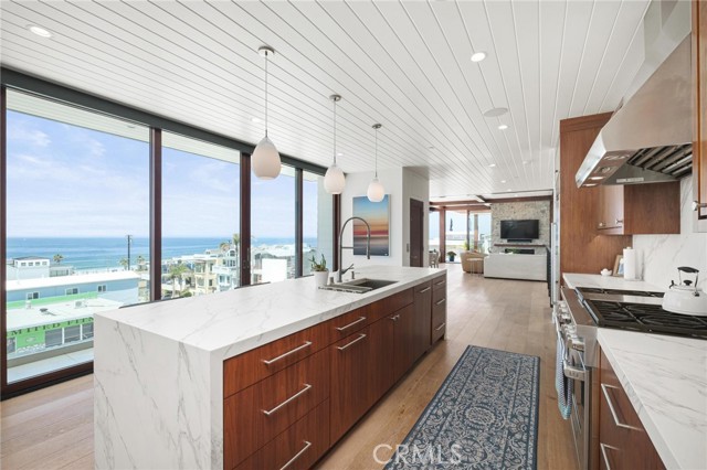 Kitchen view looking WNW at Ocean, elevator and living room