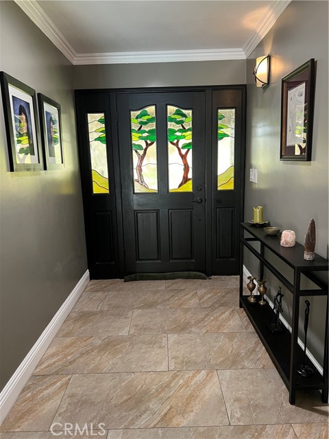 Entry way with original stained glass door