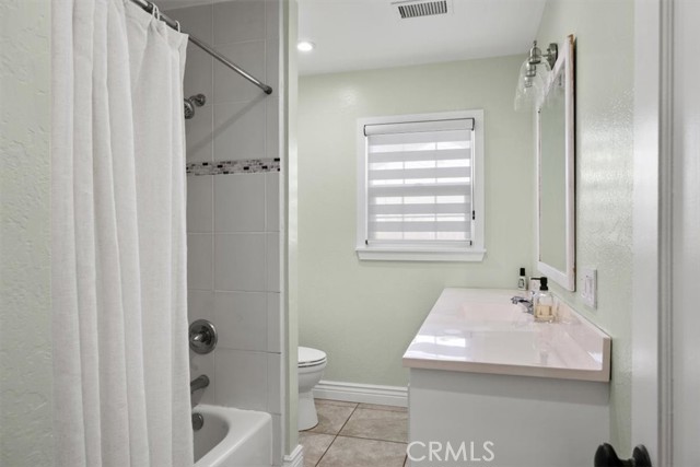 Hallway bathroom with tub/ new tile and remodeled bathroom