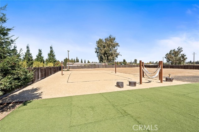 Full sized regulation sand volleyball court - hammocks on wood posts