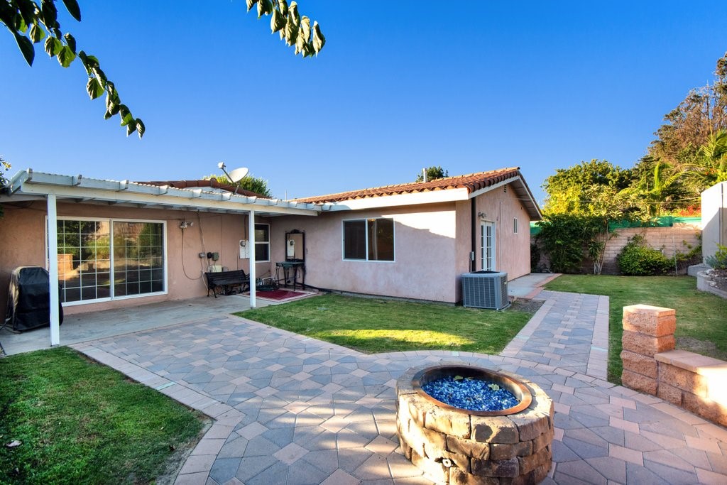 Back yard with Fire Pit  - showing Large sliding door of the living Room