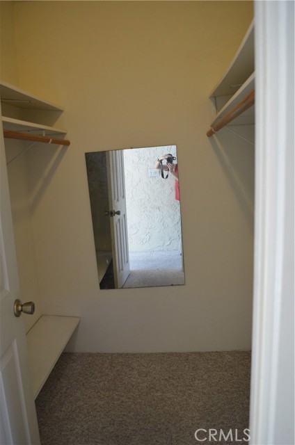 Walk-in closet in hallway that connects both rooms