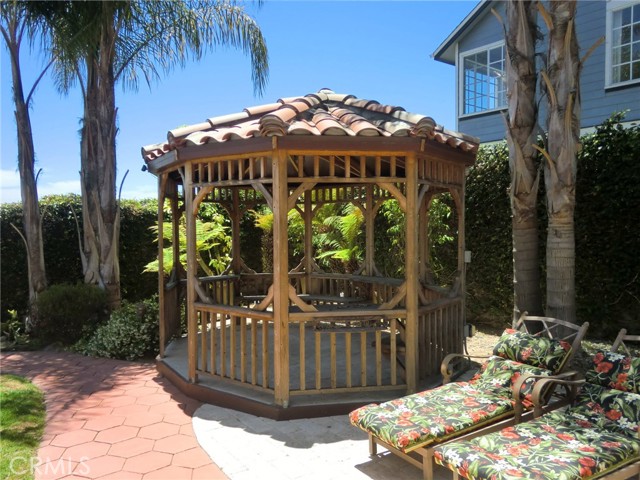 Gazebo with clay tile roof, ceiling light, electrical outlets and USB charging ports.