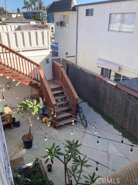 Entrance to private staircase through shared courtyard