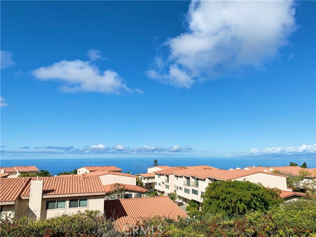28301 Ridgehaven Court 75 Rancho Palos Verdes, California View! View! View! Grab your favorite drink and relax in the comfort of your favorite chair as you watch the Summer sunsets! Nestled on the highest peak of the Mira Verde community, this end unit 2-bedroom with a bonus room condo and direct access to garage has been tastefully upgraded and is ready for you to move in. The split-level unit features an open floor plan which flows from the living room to the dining area and kitchen. Entering the front door, the living room is highlighted by a captivating ocean view, custom designed fireplace, and high ceilings. Stepping outside, the private patio has stunning panoramic ocean views up to Malibu. Beautiful kitchen along with the abundance of granite countertop space and an additional prep sink and ample storage within the custom cabinets, is the dream of any chef. Located on the top level, the master suite is graced with hardwood floors and a generous walk-in closet. Travertine tiles, dual sinks, and a soothing whirlpool tub adorn the master bathroom. This end unit is surrounded by lush landscaping and walking paths that lead to wonderful amenities including a pool, tennis and basketball courts, and an outdoor BBQ area. HOA includes trash, cable, earthquake insurance, and 24 hr. security guard. Come on over and take a look for yourself before it's gone. Buyer and Buyer's Agent to confirm all information to their satisfaction.