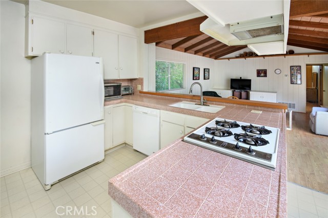 Kitchen. Refrigerator, dishwasher and range.