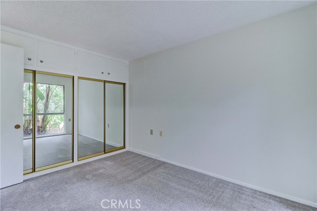 Mirrored closet doors in front bedroom