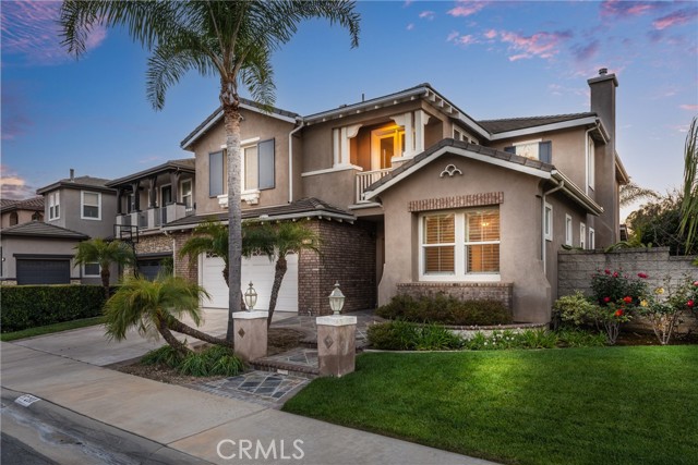 CITY LIGHT and SUNSET VIEW! Stunning Shea Homes-built residence with 5 bedrooms (3 are suites)plus loft plus mainfloor bonus area on end of cul de sac home site in Yorba Linda's popular Vista Del Verde neighborhood centered around  Black Gold golf course* This gorgeous home has gorgeous new LVP flooring throughout main level and brand new carpet upstairs with the perfect shade of white wall color and new base molding making this open and airy home ready to move into. Through the double door entry the spiral wrought iron staircase is equally as impressive as the cathedral ceilings and clearstory windows over formal living and dining rooms. Convenient MAINFLOOR MINI SUITE #5 is to right of front door - ideal for multi-generational living. The gorgeous kitchen with beautifully contrasting white cabinetry and 'uba tuba' granite blended with the stainless steel appliances including built in refrigerator and anchored by the island has a walk in pantry and ots of workspace and storage. Breakfast nook is a great place for informal meals. Kitchen and nook are wide open to oversized family room with double sided fireplace and the GREAT builder option bonus room is on the other side - makes a great main floor game table room or ? Inside laundry room with sink is next to lower bonus area. Up the spiral staircase are the GORGEOUS, oversized primary suite with panoramic views, view balcony, bath with jetted spa tub and dual vanities and a walk in closet. Also upstairs are 2 more generously-sized bedrooms, a full hallway bath, a beautiful junior suite (#4), and next to that a beautiful loft open to living area below and also has French door/balcony looking out to front of home. The backyard is where the fun is!! Enjoy evenings under the stars watching the sunset - Lawn area plus patio have beautiful western views all the way to DTLA and Catalina Island. Double car garage with interior accessories and full sized driveway. This home is .25 mile up the hill from Lakeview Elementary and also attends Yorba Linda Middle and El Dorado High schools. No HOA or Mello roos.