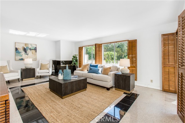 open concept living takes in the pastoral view in back yard
