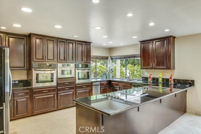 Dark Cherry cabinets and a superb kitchen for entertaining.