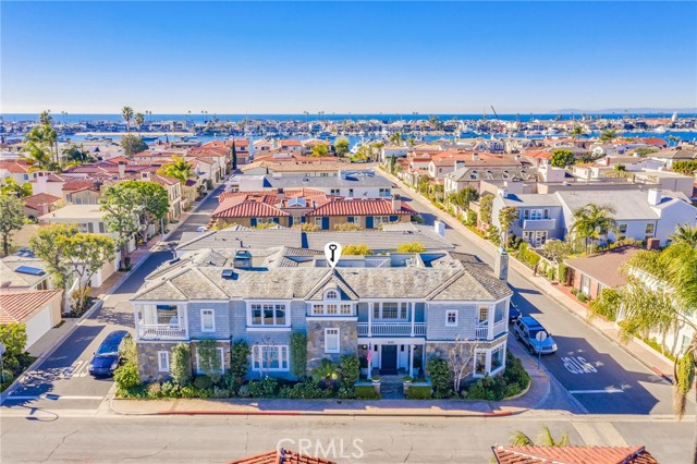 805 Via Lido Nord Newport Beach, California Classic architecture at the desirable eastern end Lido Isle. When driving through this waterside community this is one of those properties where the common theme that is stated is “I love that home”. Impeccable construction fused with a beautiful curb presence and the home only gets more impressive once inside. Enjoy views, space, an enviable location, timelessness and the quality that has been employed in every facet of this residence. Sited an exceptionally large, corner parcel with views of the bay, this East Coast, traditional style home is complemented by a variety of fabulous highlights including walnut wood floors, high ceilings, custom millwork, stone counters, premium appointments and inviting living, family, outdoor and entertaining spaces. Approximately 4700sf with five generous bedrooms, an upper-level family room, expansive, private back yard with spa and seating areas, this home is truly one of the finest within this island enclave. Tasteful, comfortable elegance is combined in an idyllic setting, with a guest dock and water access just strides away, the home sets the stage for stylish living. Formal living and dining rooms, a spacious kitchen/family room for gathering, first-level suite, sizable secondary bedrooms, a sumptuous master suite with water views and a roof-top deck with stunning vistas create an impressive property.