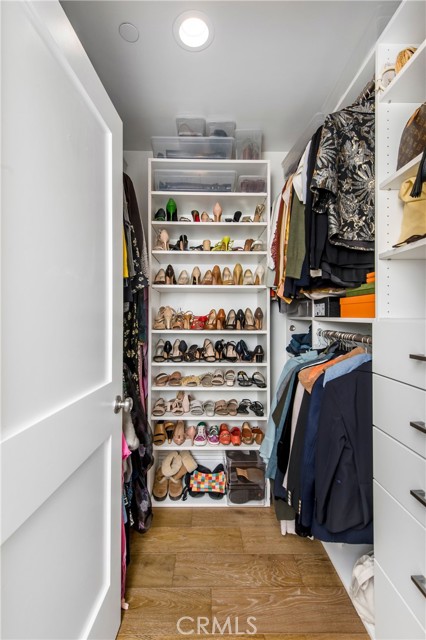 One of two primary closets.