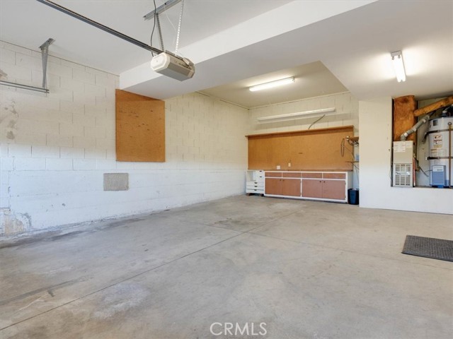 Two Car garage has storage closets AND a workshop area.