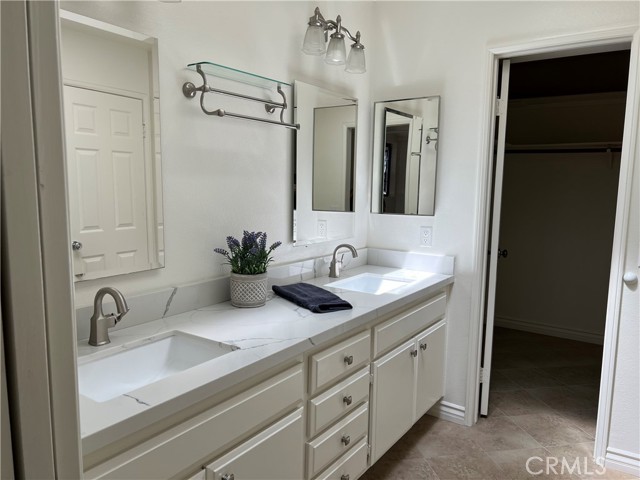 Primary Bathroom with walk-in closet