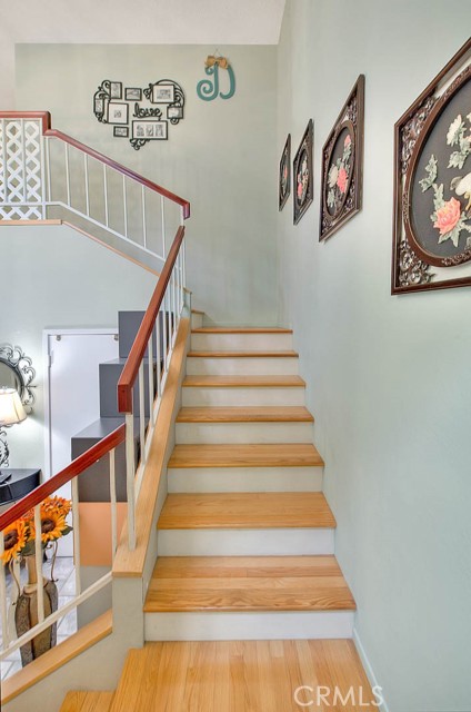 Stairway To Upstairs. Extra Strength Steel Railing With Wood Banister.  Real Wood Flooring.