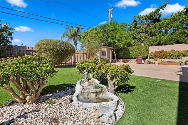 Backyard - Just outside the sunroom is this fountain, adding the soothing sound of flowing water to the space.