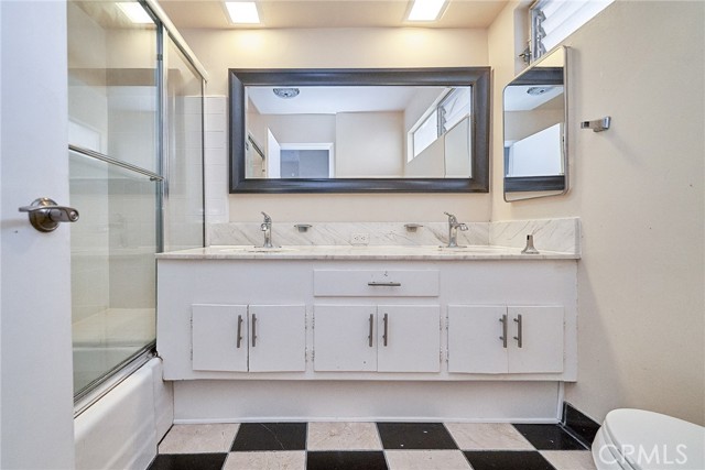 Primary bathroom with dual sink and tub
