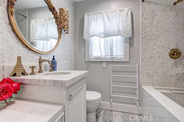 Exquisite hall bath includes a spa tub.