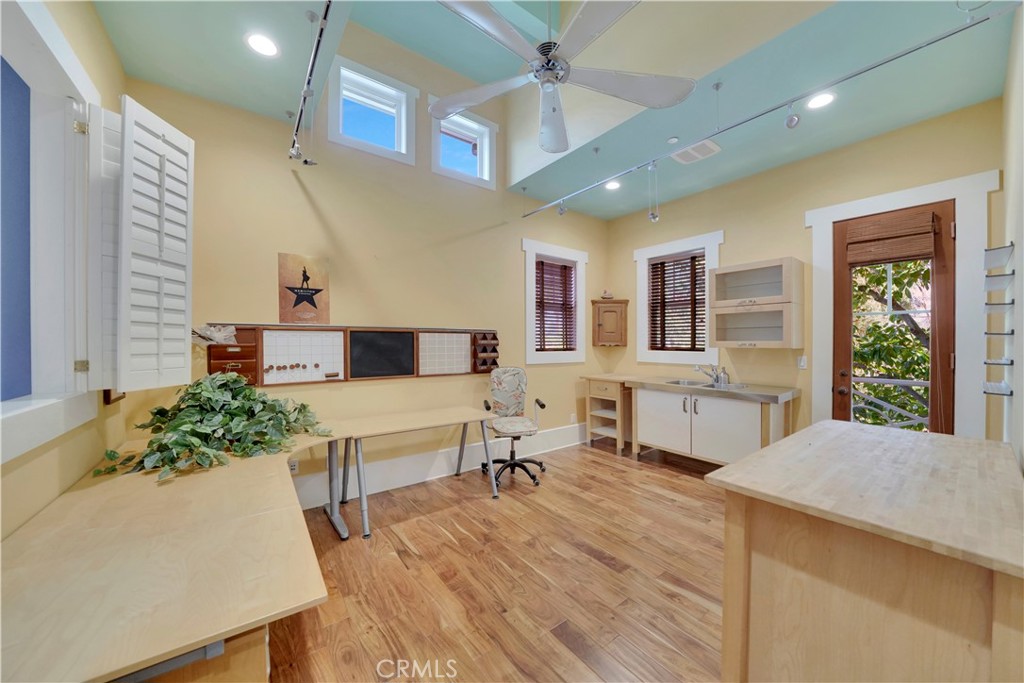 hobby room with wood floors and outdoor access
