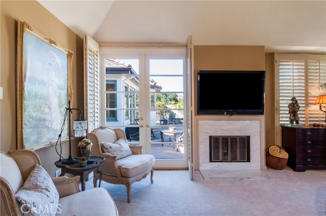 Master suite has it's own fireplace and french doors that open to the backyard oasis....