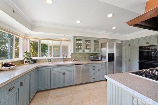 1926 Altura Drive Corona del Mar, California Fabulous upgraded single story home in highly desirable Irvine Terrace neighborhood. Located on one of the best interior streets in the neighborhood, this 3 bedroom, 2 bath home sits on an oversized 9,100 square foot lot with beautifully landscaped grounds and large private backyard. The residence offers a recently remodeled kitchen, built in desk for a separate home office, in kitchen eating area plus formal dining, built-in media niche in the oversized living/family room, recessed lighting, remodeled master bath and dual pane doors and windows throughout. The ultimate Corona del Mar lifestyle with world class beaches, upscale shopping, fine dining and one of Orange County's most sought after communities.
