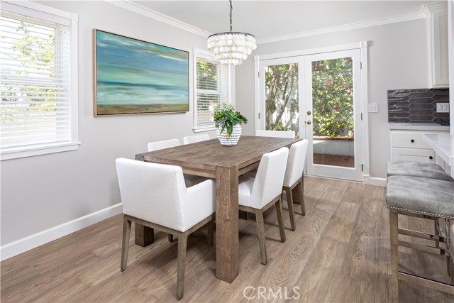 Dining room with French doors to backyard.