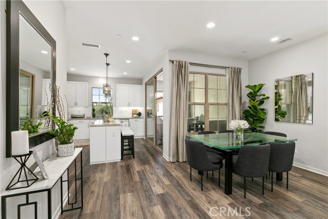 Expansive dining room open to the elegant kitchen and living areas.