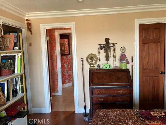 The colorful wall paper, stylish furniture and artifacts create an artistic vibe.