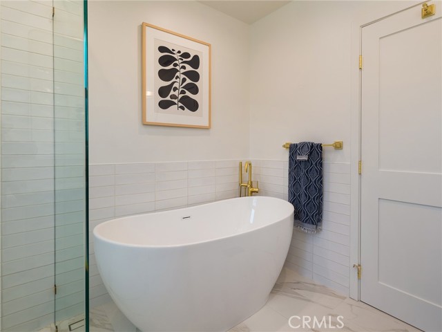 Soak your day away in your primary bathroom tub.