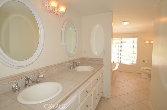 Master bathroom with double sinks and mirrors Master bathroom with double sinks and mirrors