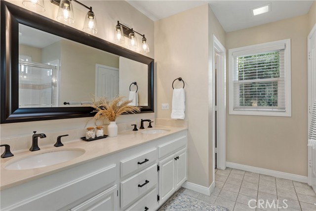 Primary Bathroom: Freshly Painted Full Bath with New Low- Flow Toilet.