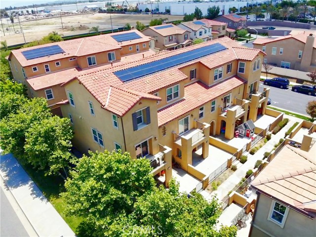 10403 Persimmon Court Santa Fe Springs, California A luxurious style condo awaits you. This modern home is a rare gem in the reputable "The Villages in Santa Fe Springs". Indoor and outdoor living unite in this 4 bedroom, 3 bath highly desirable corner unit. With heights over 10" and an outdoor terrace, the design redefines modern living. The open concept kitchen is built around a top-of-the-line stainless steel range. There are designer custom cabinets and stone countertops that provide an upscale flare to this magnificent kitchen. The property features energy saving solar panels, EV charging station, central AC/Heat, dual pane windows and a tankless water heater. This unit has a spacious 2 car garage with a direct connection from a private driveway that leads in and out of this 24 hour gated community. Enjoy the city life with close proximity to all major venues or a nice staycation with complex amenities from the residence clubhouse styled pool, fitness center, children's playground and dog park...WOW, luxury living at it's finest!!!