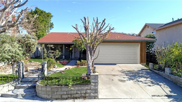 Digitally enhanced and staged Front of Home with attached garage
