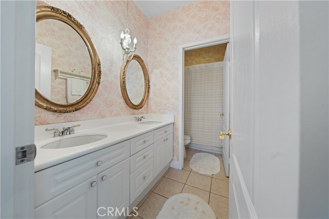 Bathroom #3: Dual vanity and separate room for toilet shower/tub.