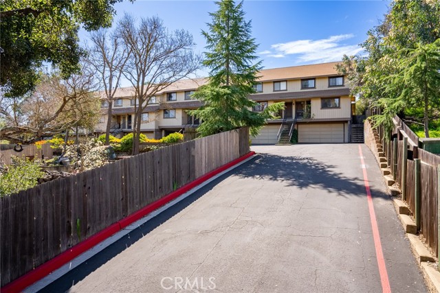 Follow the fenced driveway up to the condo.