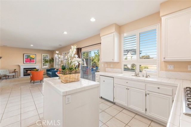 The kitchen features ample natural lighting, creating a bright and inviting space.