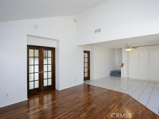 View from living room showing dining area with abundant storage cabinets