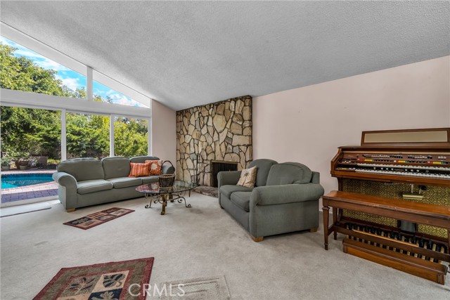 Watch kids in pool from living room, kitchen and family rooms.