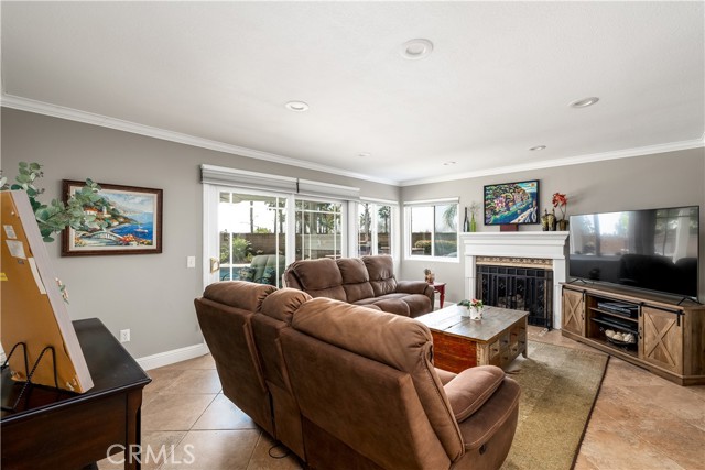 Family room with fireplace and slider to the backyard.