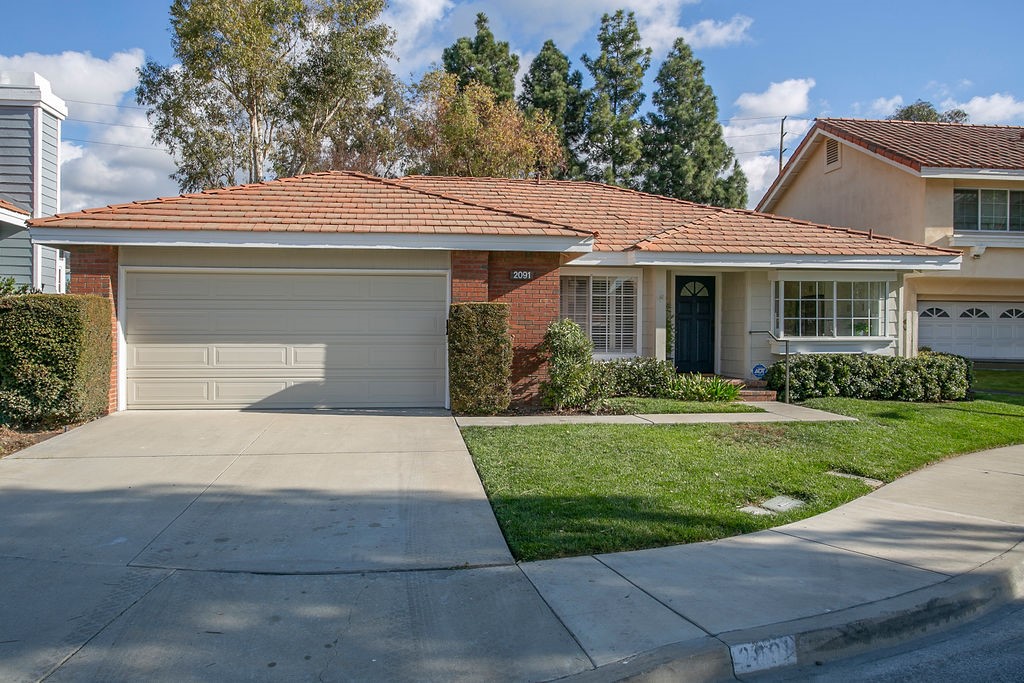 Nestled in the highly desirable Shadow Brook community of Tustin Ranch, this stunning single level detached home offers an elegant blend of modern upgrades and timeless charm. Featuring 3 bedrooms (one room is currently being used as a den) and 2 bathrooms, every detail has been thoughtfully curated for luxurious living. Step inside to discover an open and inviting floor plan with high-quality waterproof SPC vinyl plank flooring throughout and an entryway designed with striking porcelain tile. The den and kitchen feature eye catching shiplap ceilings, adding a warm, contemporary touch. The fully remodeled kitchen is a chef's dream, boasting brand new soft close cabinets, a sleek non-porous porcelain slab countertop and stainless steel appliances. The bathrooms are a true masterpiece. The secondary bathroom showcases a white nest marble floor, a custom color glazed ceramic tile shower and a man made Quartz countertop. The primary bathroom exudes luxury with a stunning inset floor design, a white haze marble floor in the water closet and shower area, ribbed porcelain on the shower walls and bathroom floor, and a Borghini Calcutta marble countertop. Enjoy California living in the quaint backyard, featuring vibrant bougainvillea and fruit trees - a perfect space for entertaining. This home's seamless flow and upscale finishes make it perfect for both relaxing and entertaining. Situated on a quiet cul-de-sac street, this home features a rare driveway and a 2-car attached garage, providing convenience and extra parking. Located near parks, trails and award winning schools, this property truly has it all. Don't wait, your dream home awaits!