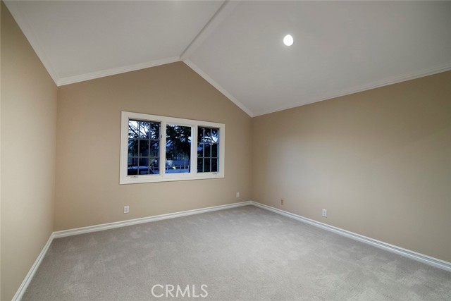 Front Secondary Bedroom with vaulted ceilings.