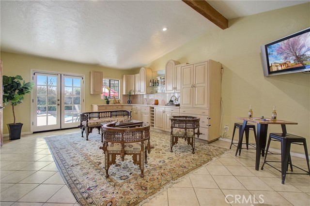 Family room just off of the kitchen with wet bar and plenty more storage and counter space!