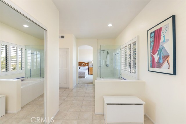 The master bathroom offers both a shower and a bathtub for added versatility