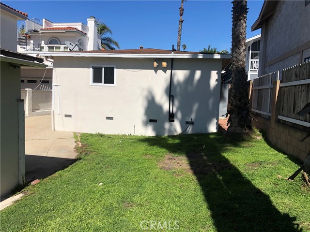 Back of the back house which now has a deck plus the grassy area