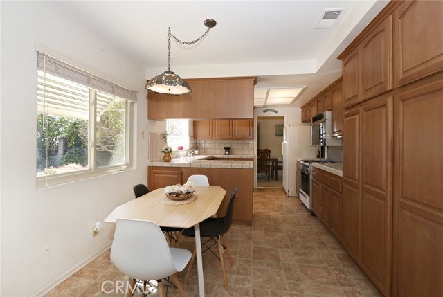 Kitchen dining area with lots of cabinets